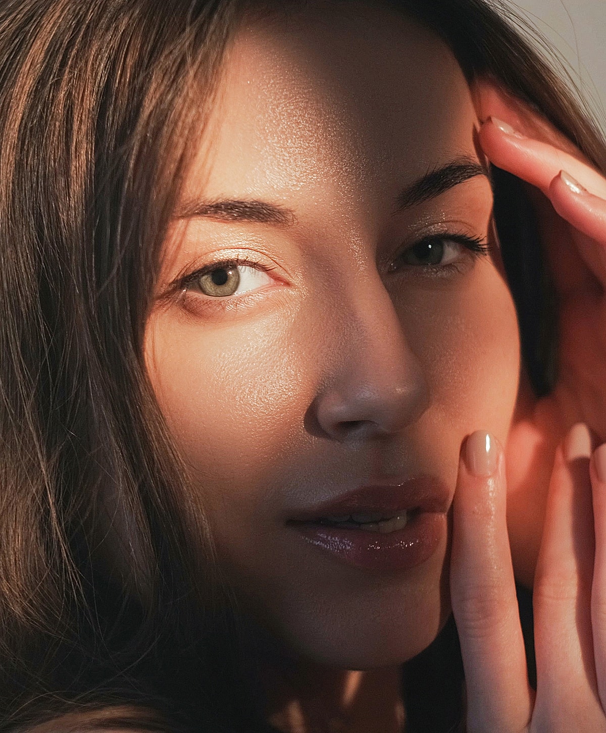 Woman with striking eyes and soft lighting.