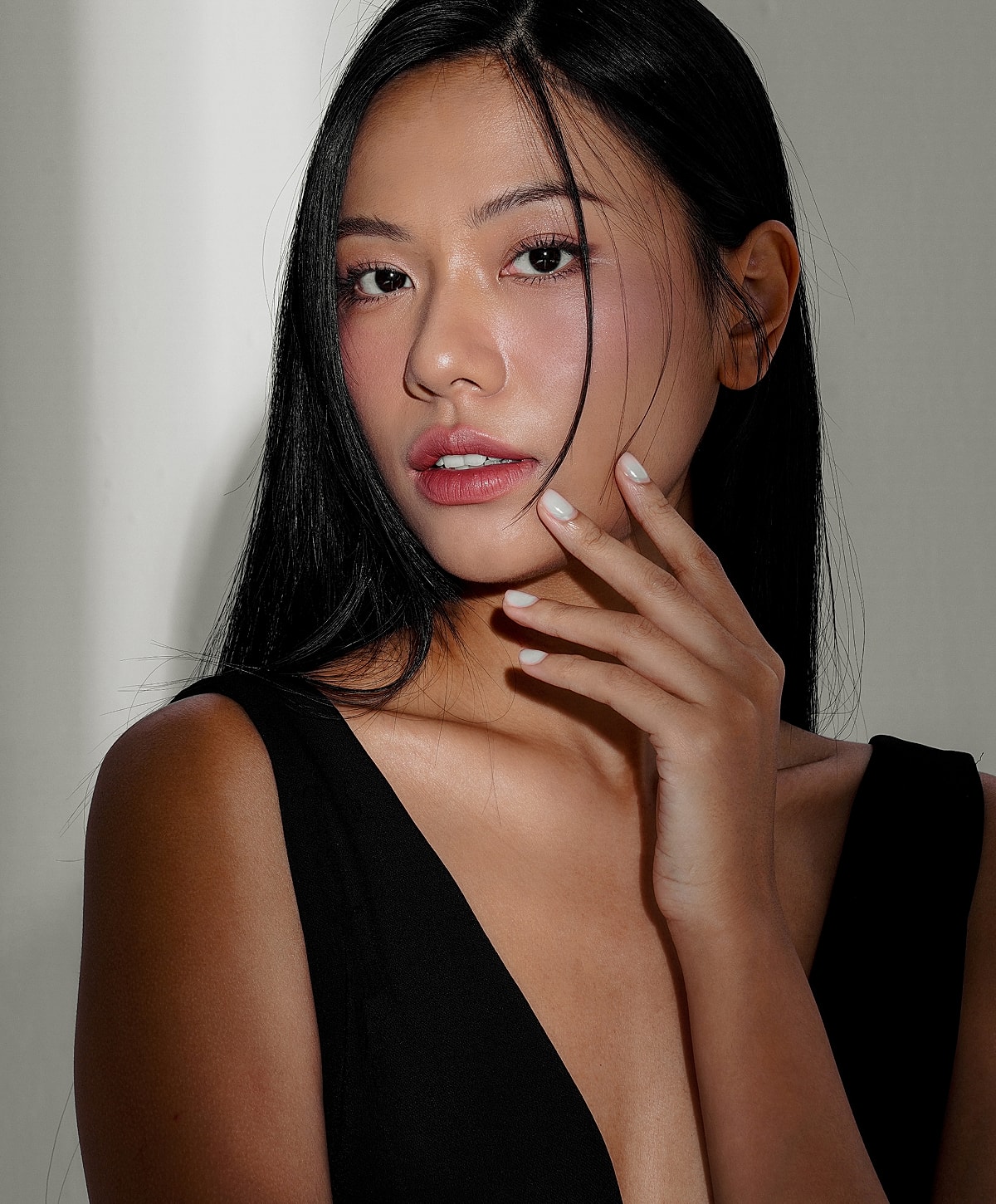 Portrait of a woman with long black hair.